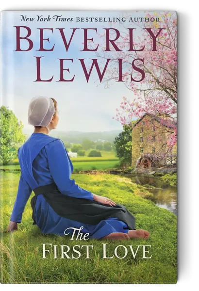 Amish woman sitting in the grass