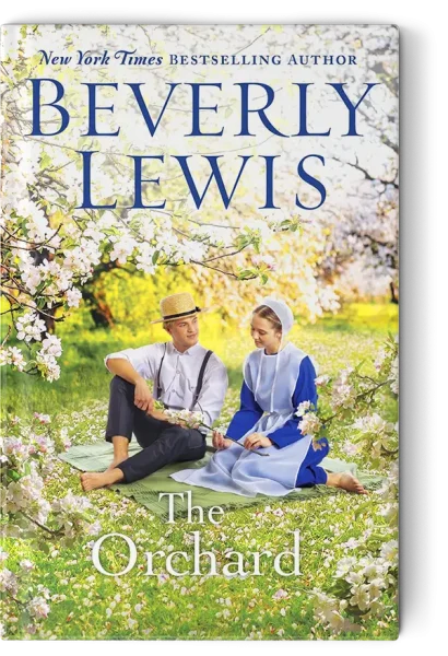 Amish man and woman sitting under blossoming trees